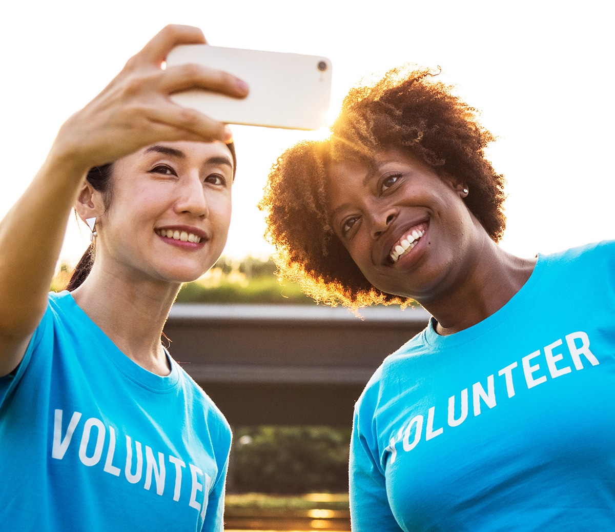 Two volunteer persons taking selfie