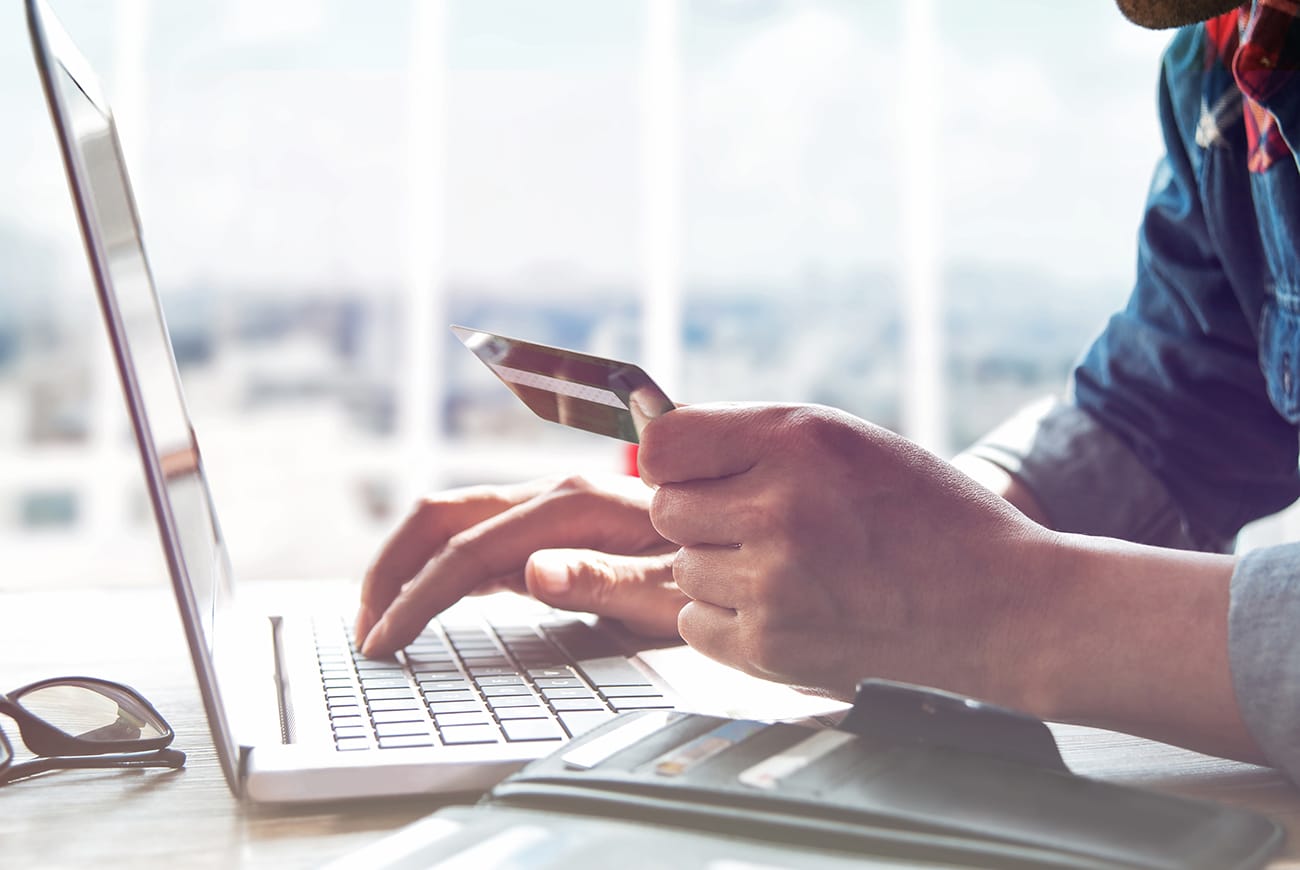 Person Shopping Online Using  Laptop